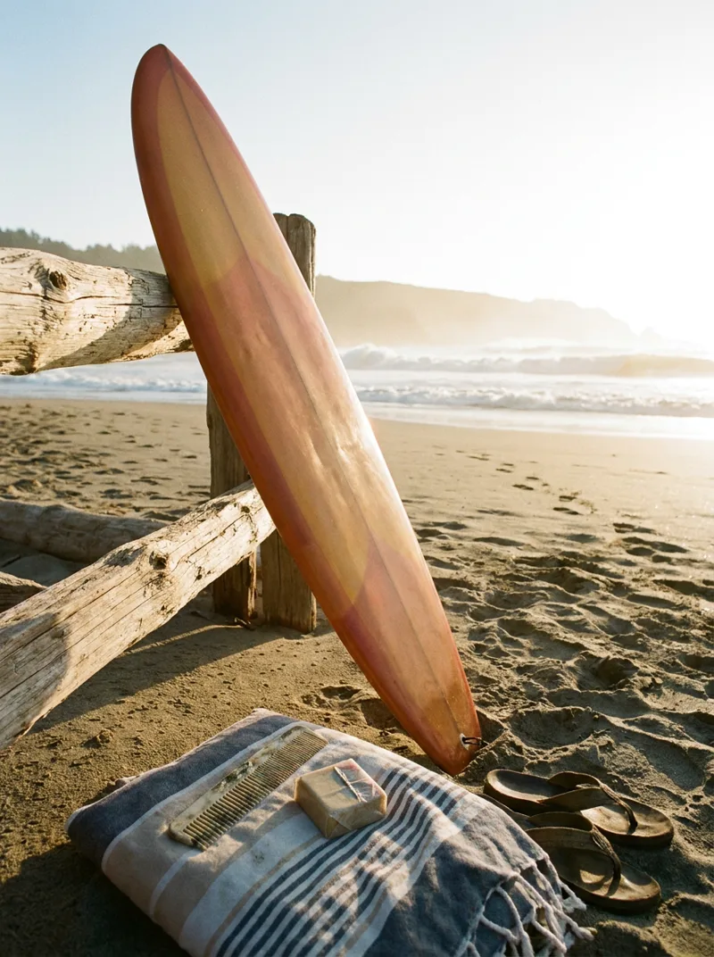 Generated ad visual — surfer cutting across a wave at golden hour